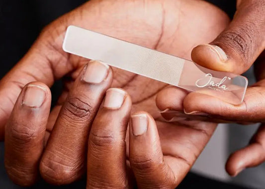 Man using the JADA Nano Glass Nail File to smoothly shape and seal natural nail edges.